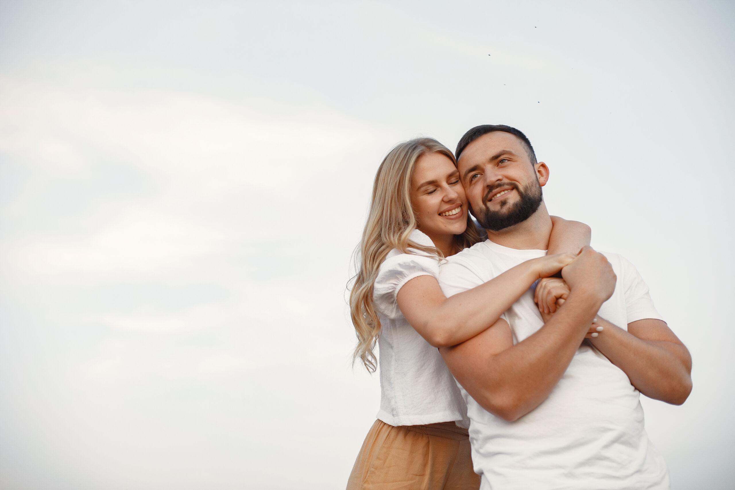 Beautiful couple spend time in a autumn field